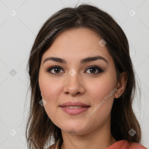 Joyful white young-adult female with long  brown hair and brown eyes