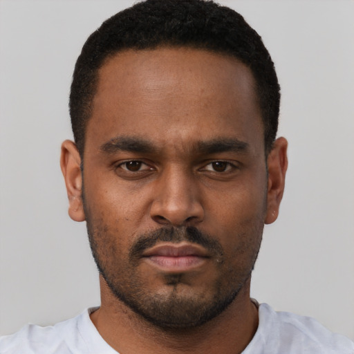 Neutral black young-adult male with short  brown hair and brown eyes