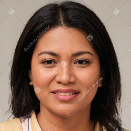 Joyful latino young-adult female with medium  brown hair and brown eyes