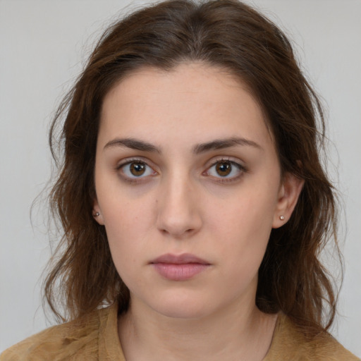 Neutral white young-adult female with medium  brown hair and brown eyes