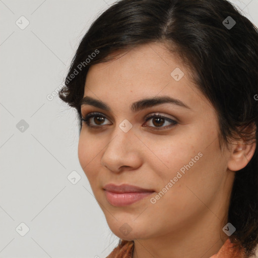 Joyful latino young-adult female with medium  brown hair and brown eyes