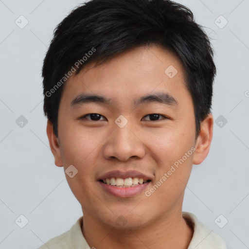 Joyful asian young-adult male with short  black hair and brown eyes