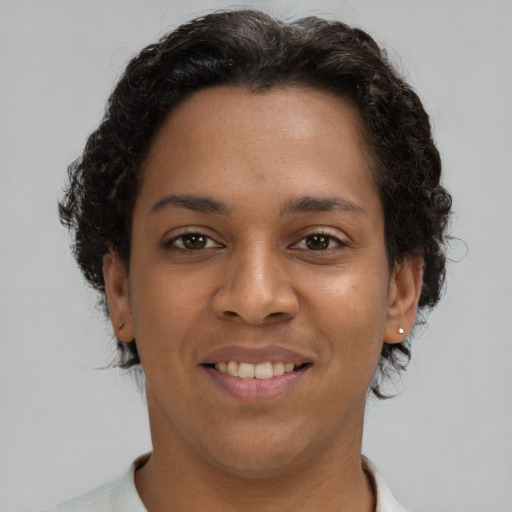 Joyful latino young-adult female with short  brown hair and brown eyes