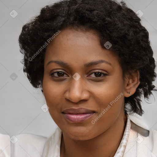 Joyful black young-adult female with long  brown hair and brown eyes