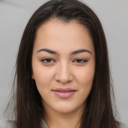 Joyful asian young-adult female with long  brown hair and brown eyes