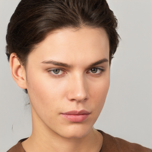 Neutral white young-adult female with short  brown hair and brown eyes