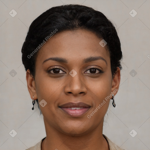 Joyful black young-adult female with short  black hair and brown eyes
