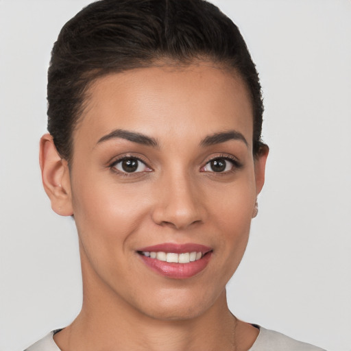 Joyful white young-adult female with short  brown hair and brown eyes