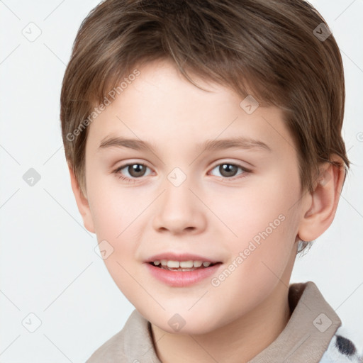 Joyful white child male with short  brown hair and brown eyes