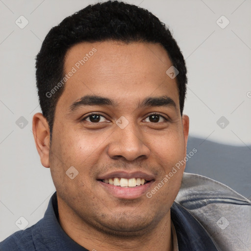 Joyful white young-adult male with short  black hair and brown eyes