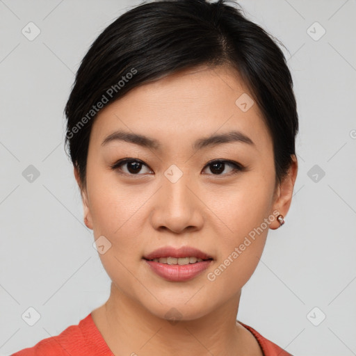 Joyful asian young-adult female with short  black hair and brown eyes