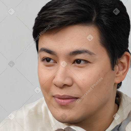 Joyful asian young-adult male with short  brown hair and brown eyes