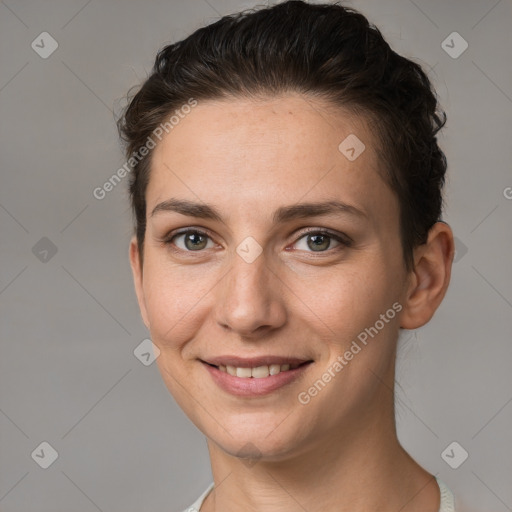 Joyful white young-adult female with short  brown hair and brown eyes