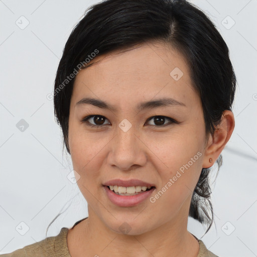 Joyful asian young-adult female with medium  brown hair and brown eyes