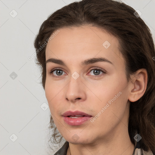 Neutral white young-adult female with long  brown hair and brown eyes