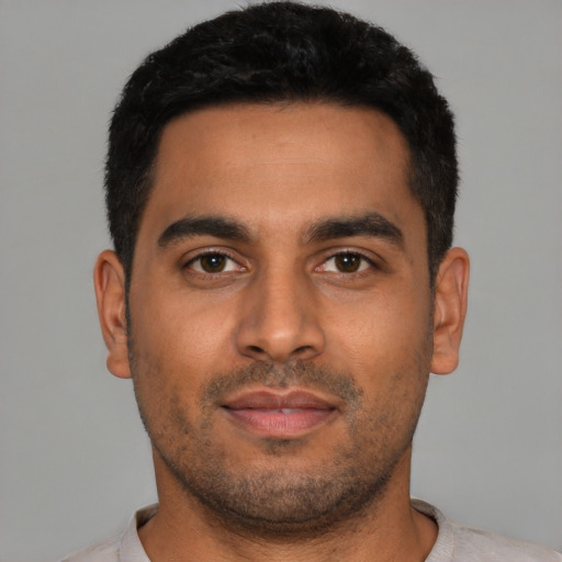 Neutral latino young-adult male with short  black hair and brown eyes