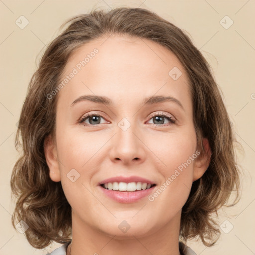 Joyful white young-adult female with medium  brown hair and green eyes