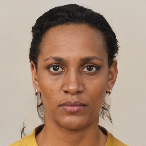 Neutral black young-adult female with short  black hair and brown eyes