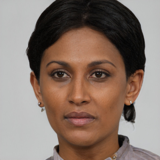 Neutral asian adult female with short  black hair and brown eyes