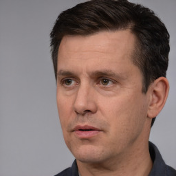 Neutral white adult male with short  black hair and brown eyes