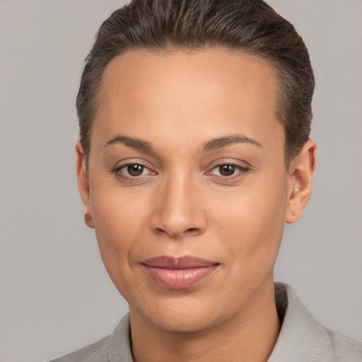 Joyful white young-adult female with short  brown hair and brown eyes