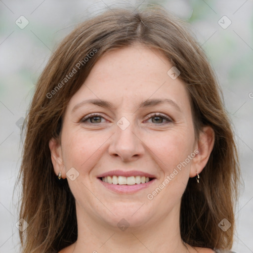 Joyful white adult female with medium  brown hair and grey eyes