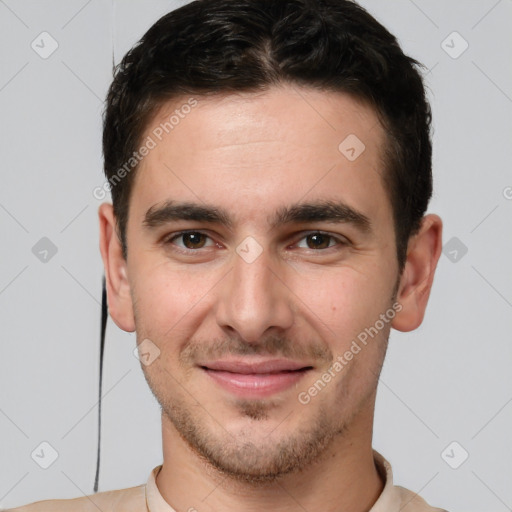 Joyful white young-adult male with short  brown hair and brown eyes