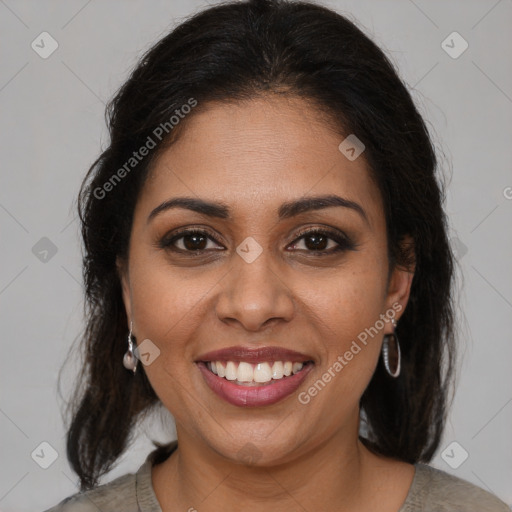 Joyful black young-adult female with medium  brown hair and brown eyes