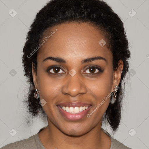 Joyful black young-adult female with medium  black hair and brown eyes