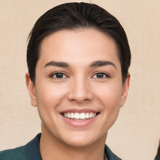 Joyful white young-adult female with short  brown hair and brown eyes