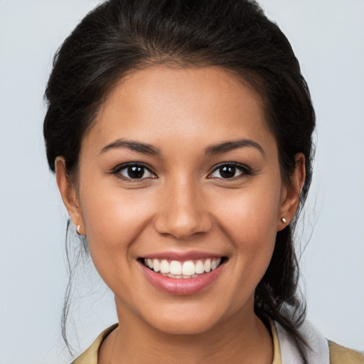 Joyful white young-adult female with medium  brown hair and brown eyes