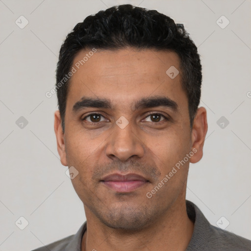 Neutral latino young-adult male with short  black hair and brown eyes