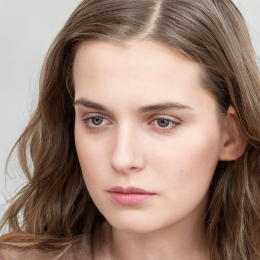 Neutral white young-adult female with long  brown hair and grey eyes