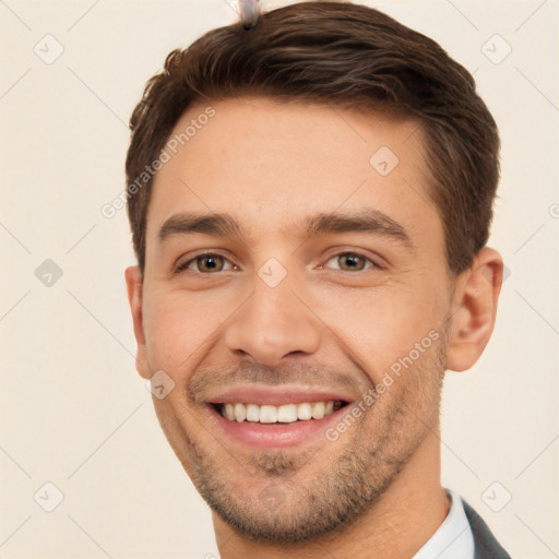 Joyful white young-adult male with short  brown hair and brown eyes