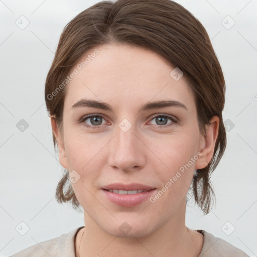 Joyful white young-adult female with medium  brown hair and grey eyes