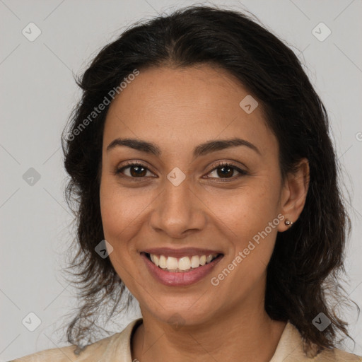 Joyful latino young-adult female with medium  brown hair and brown eyes