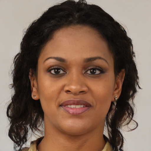 Joyful black young-adult female with medium  brown hair and brown eyes