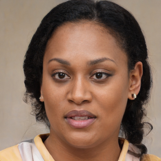 Joyful black young-adult female with medium  brown hair and brown eyes