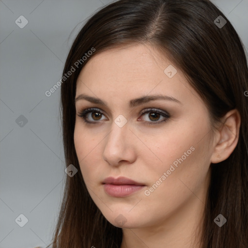 Neutral white young-adult female with long  brown hair and brown eyes