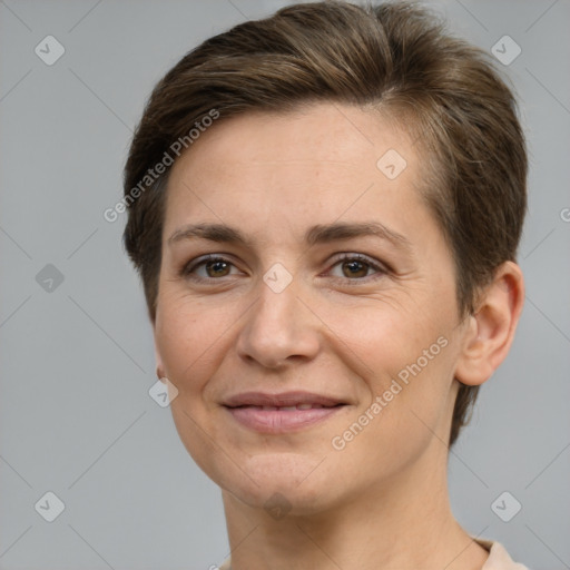 Joyful white adult female with short  brown hair and brown eyes