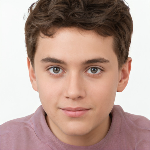 Joyful white child male with short  brown hair and brown eyes