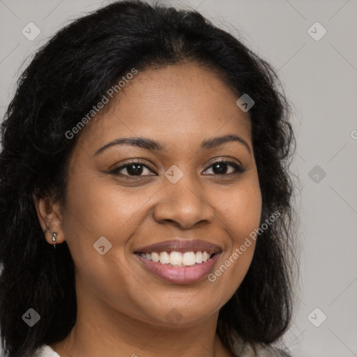 Joyful black young-adult female with long  brown hair and brown eyes