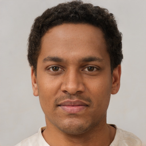 Neutral black young-adult male with short  brown hair and brown eyes