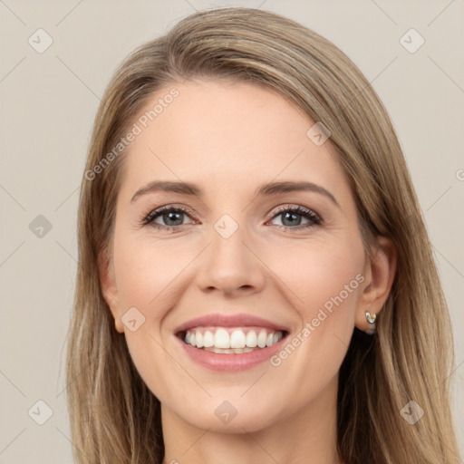 Joyful white young-adult female with long  brown hair and green eyes