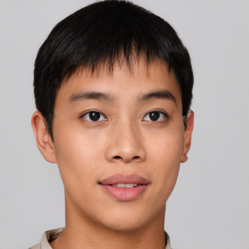 Joyful asian young-adult male with short  brown hair and brown eyes