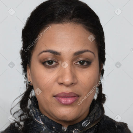 Joyful latino adult female with medium  brown hair and brown eyes