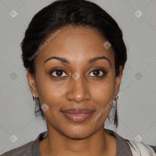 Joyful black young-adult female with medium  black hair and brown eyes
