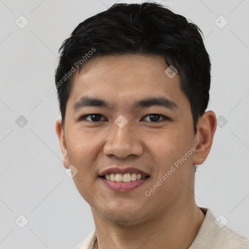 Joyful asian young-adult male with short  black hair and brown eyes