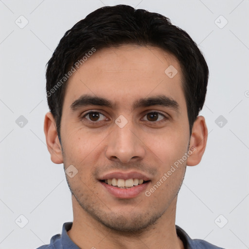 Joyful white young-adult male with short  black hair and brown eyes