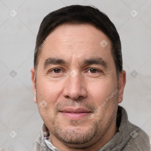 Joyful white adult male with short  brown hair and brown eyes